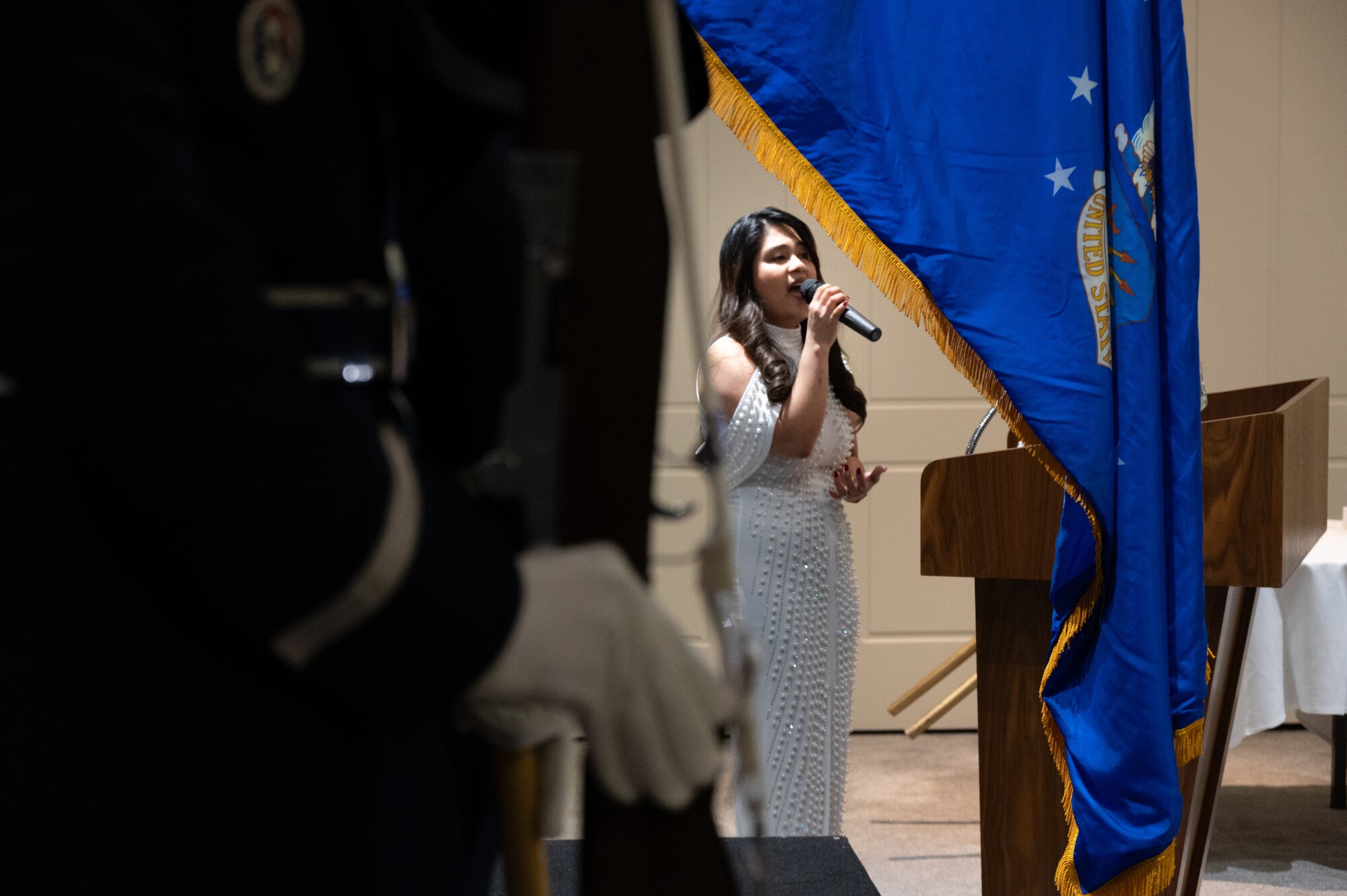Mrs. Jackie Gollihar performs the United States National Anthem during the 501st Combat Support Wing annual awards ceremony