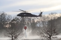 U.S. Army Soldiers with Company A, 111th General Support Aviation Battalion, 59 Aviation Troop Command, South Carolina National Guard, dropped water from helicopters March 2, 2025, to help the South Carolina Forestry Commission and the South Carolina Department of Natural Resources contain wildfire in Horry County. Guard members assisted for a week, handing off to the Georgia Army National Guard.