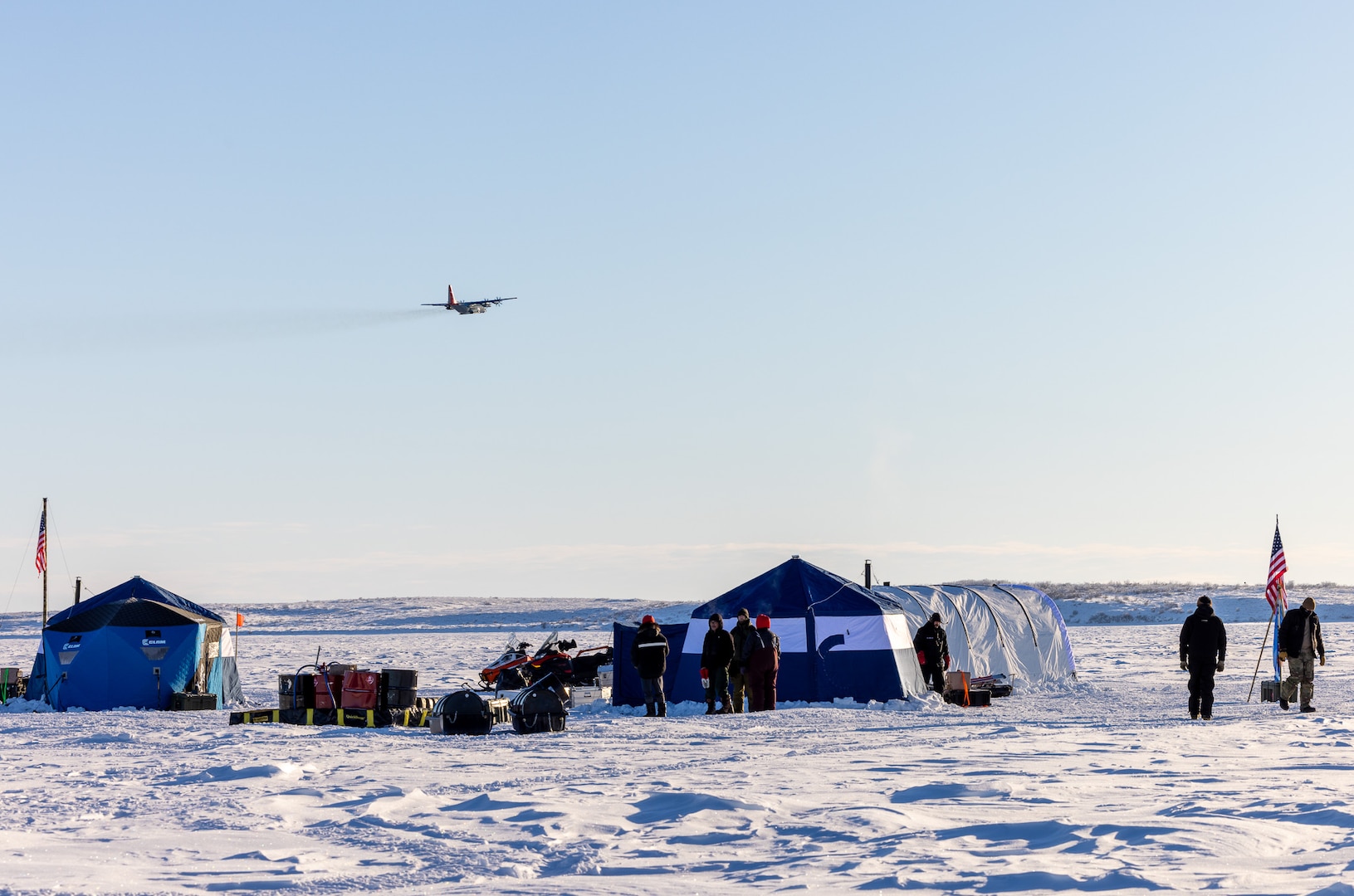 A LC-130 Hercules assigned to the 109th Airlift Wing flies over Parsons Lake, Northwest Territories, Canada, March 4, 2025. The LC-130 Hercules can land on snow and ice using skis.