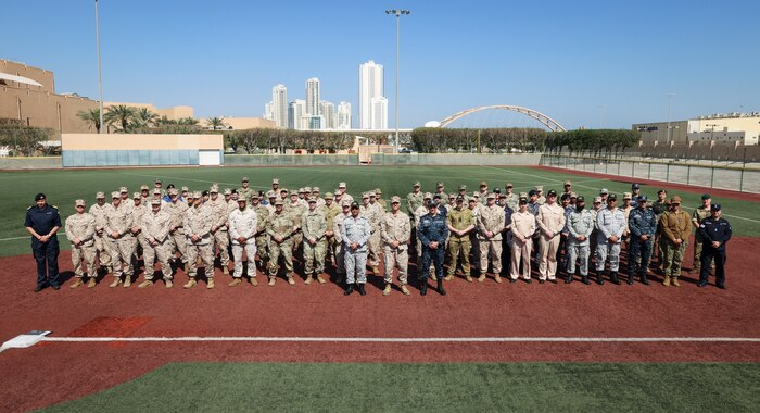 Participants of International Maritime Exercise (IMX) 2025 pose for a group photo. IMX25 is the largest multinational training event in the Middle East, involving 5,000 personnel from around 30 nations and international organizations committed to preserving the rules-based international order and strengthening regional maritime security cooperation.