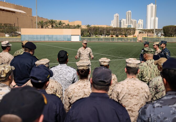 U.S. Marine Corps Brig. Gen. Stephen Lightfoot, center, the commanding general of Task Force 51/5th Marine Expeditionary Brigade, speaks with participants of International Maritime Exercise (IMX) 2025. IMX25 is the largest multinational training event in the Middle East, involving 5,000 personnel from around 30 nations and international organizations committed to preserving the rules-based international order and strengthening regional maritime security cooperation. (U.S. Marine Corps photo by Sgt. Angela Wilcox)