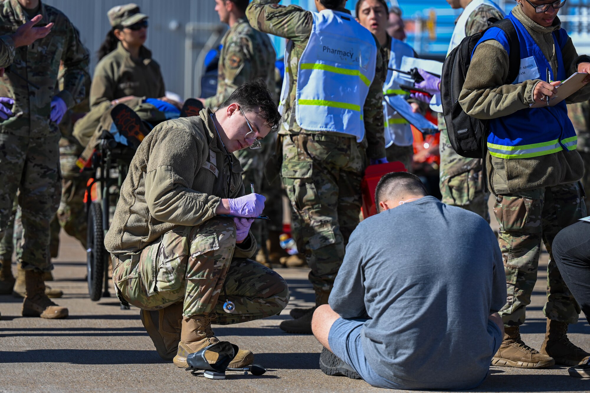 U.S. Air Force Airman Cadan Avans, 97th Operational Medical Readiness Squadron medical technician, records a patient's status during a Sustainment Operations exercise for Air Force Medical Responders at Altus Air Force Base, Oklahoma, Feb. 27, 2025.