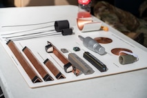 Inert explosives are laid out on display at an 850th RHS Construction Career Day booth.