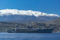 NAVAL SUPPORT ACTIVITY SOUDA BAY, Greece (March 10, 2025) The Blue Ridge-class command and control ship USS Mount Whitney (LCC 20) arrives at the NATO Marathi Pier Complex in Souda Bay, Greece, for a scheduled port visit on March 10, 2025. Mount Whitney is conducting operations in the U.S. 6th Fleet area of operations, where the ship's crew and embarked staff will work alongside allies and partners in support of maritime operations, which encompass naval diplomacy and national efforts to build comprehensive maritime power. NSA Souda Bay is an operational ashore installation that enables and supports U.S., Allied, Coalition, and partner nation forces to preserve security and stability in the European, African, and Central Command areas of responsibility. (U.S. Navy photo by Mass Communication Specialist 2nd Class Andrew Eder)