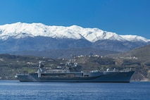 NAVAL SUPPORT ACTIVITY SOUDA BAY, Greece (March 10, 2025) The Blue Ridge-class command and control ship USS Mount Whitney (LCC 20) arrives at the NATO Marathi Pier Complex in Souda Bay, Greece, for a scheduled port visit on March 10, 2025. Mount Whitney is conducting operations in the U.S. 6th Fleet area of operations, where the ship's crew and embarked staff will work alongside allies and partners in support of maritime operations, which encompass naval diplomacy and national efforts to build comprehensive maritime power. NSA Souda Bay is an operational ashore installation that enables and supports U.S., Allied, Coalition, and partner nation forces to preserve security and stability in the European, African, and Central Command areas of responsibility. (U.S. Navy photo by Mass Communication Specialist 2nd Class Andrew Eder)