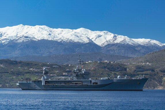 NAVAL SUPPORT ACTIVITY SOUDA BAY, Greece (March 10, 2025) The Blue Ridge-class command and control ship USS Mount Whitney (LCC 20) arrives at the NATO Marathi Pier Complex in Souda Bay, Greece, for a scheduled port visit on March 10, 2025. Mount Whitney is conducting operations in the U.S. 6th Fleet area of operations, where the ship's crew and embarked staff will work alongside allies and partners in support of maritime operations, which encompass naval diplomacy and national efforts to build comprehensive maritime power. NSA Souda Bay is an operational ashore installation that enables and supports U.S., Allied, Coalition, and partner nation forces to preserve security and stability in the European, African, and Central Command areas of responsibility. (U.S. Navy photo by Mass Communication Specialist 2nd Class Andrew Eder)