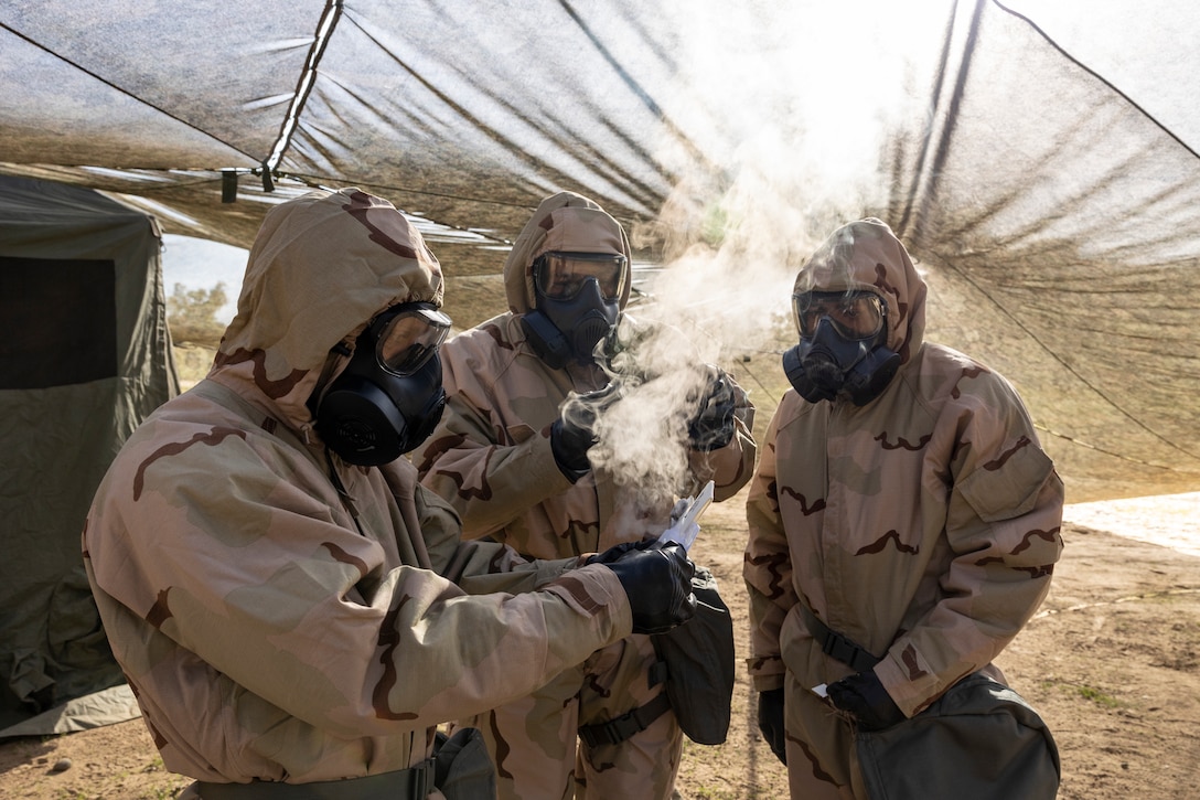 U.S. Marines with the 11th Marine Expeditionary Unit, I Marine Expeditionary Force, test for contaminants while performing a Chemical, Biological, Radiological and Nuclear defense drill during Quarterly Underway Amphibious Readiness Training 25.2 at Marine Corps Base Camp Pendleton, California, March 4, 2025. QUART is a joint training exercise designed to develop and sustain essential amphibious readiness skills for effective operations in maritime environments while reinforcing the Navy-Marine Corps partnership. (U.S. Marine Corps photo by Cpl. Oliver Nisbet)
