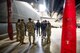 Airmen from the 5th Maintenance Group guide a tour about the outside of a B-52H Stratofortress to the Minot State University Track & Field Team at Minot Air Force Base, North Dakota, March 4, 2025. The tour group consisted of students from North Dakota, out of state and even international students. (U.S. Air Force photo by Senior Airman Kendra A. Ransum)