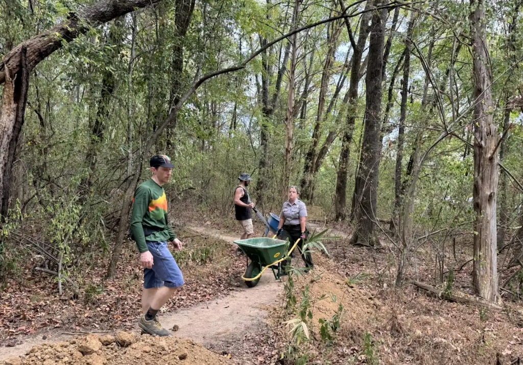 Volunteers work with U.S. Army Corps of Engineers Park Rangers at Cordell Hull Lake in Defeated, Tennessee to make improvements to the Bear Wheels Mountain Bike Trail, Sept. 21, 2024.