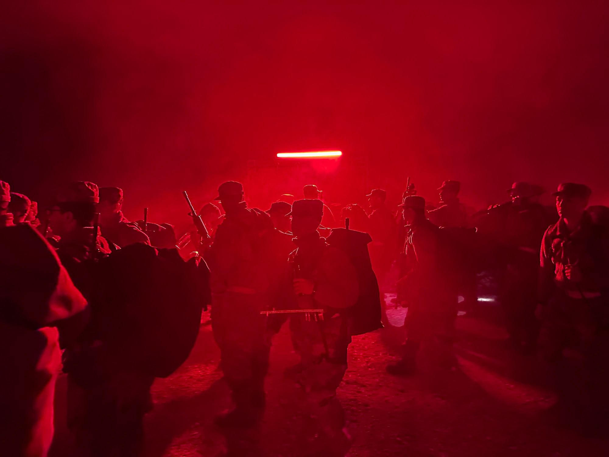 Trainees line up under the red light at the start of PACER FORGE