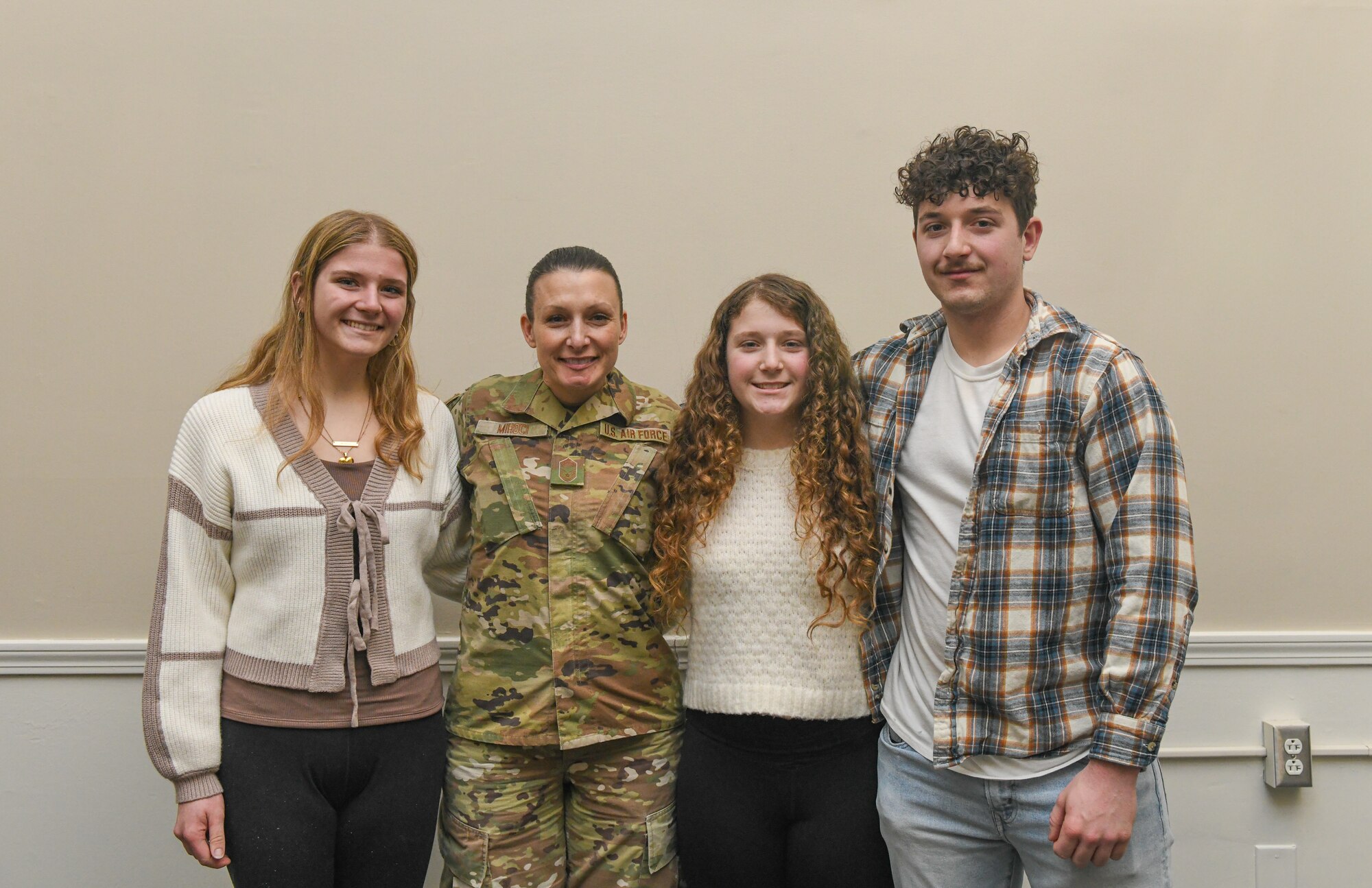 Chief Master Sgt. Renee M. Mihoci, 910th Force Support Squadron senior enlisted leader, poses for a photo with her family during her promotion ceremony at Youngstown Air Reserve Station, Ohio, Mar. 2, 2025.