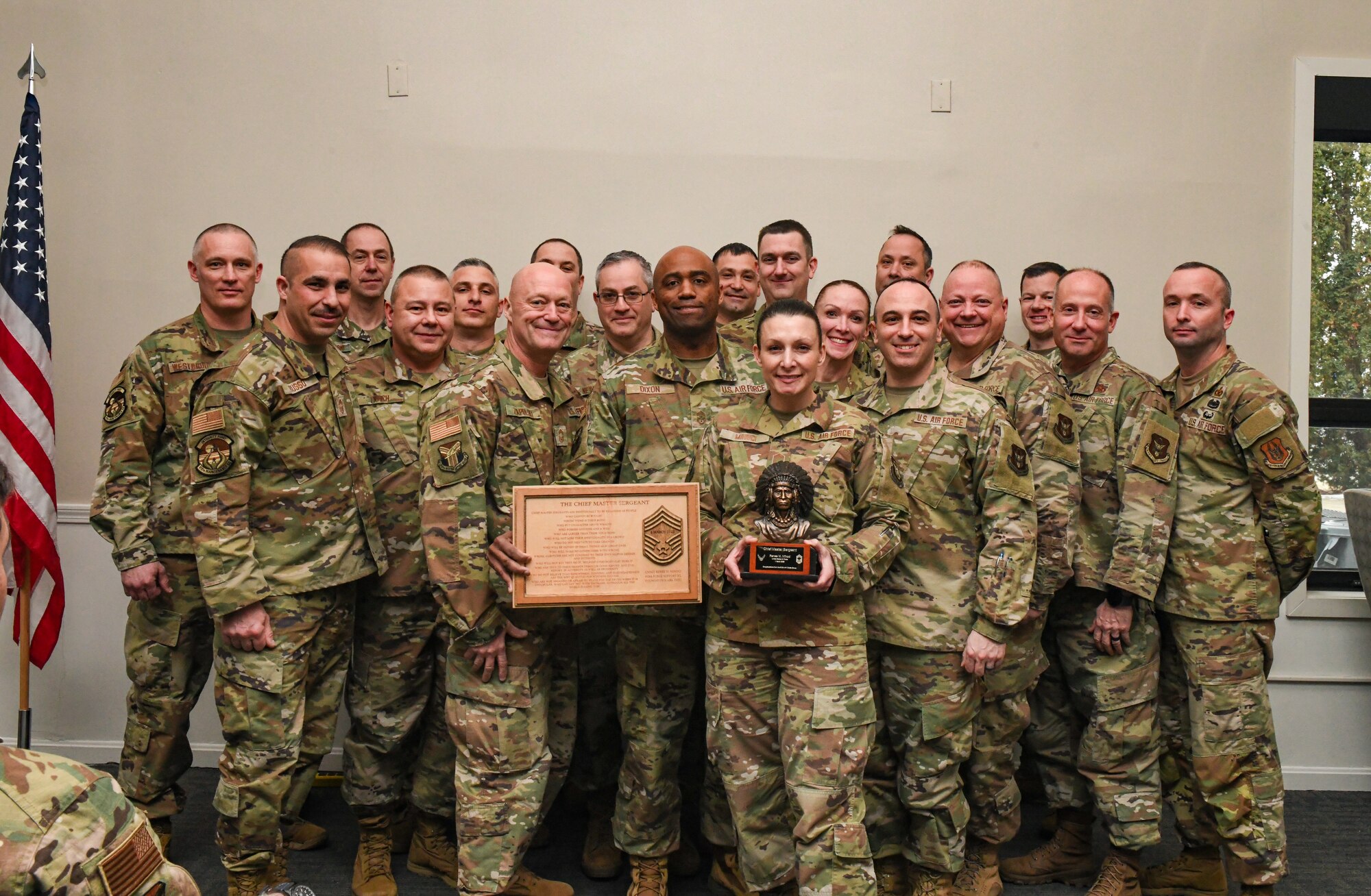 Chief master sergeants from the 910th Airlift Wing pose for a group photo during the promotion ceremony of Chief Master Sgt. Renee M. Mihoci, 910th Force Support Squadron senior enlisted leader at Youngstown Air Reserve Station, Ohio, Mar. 2, 2025.
