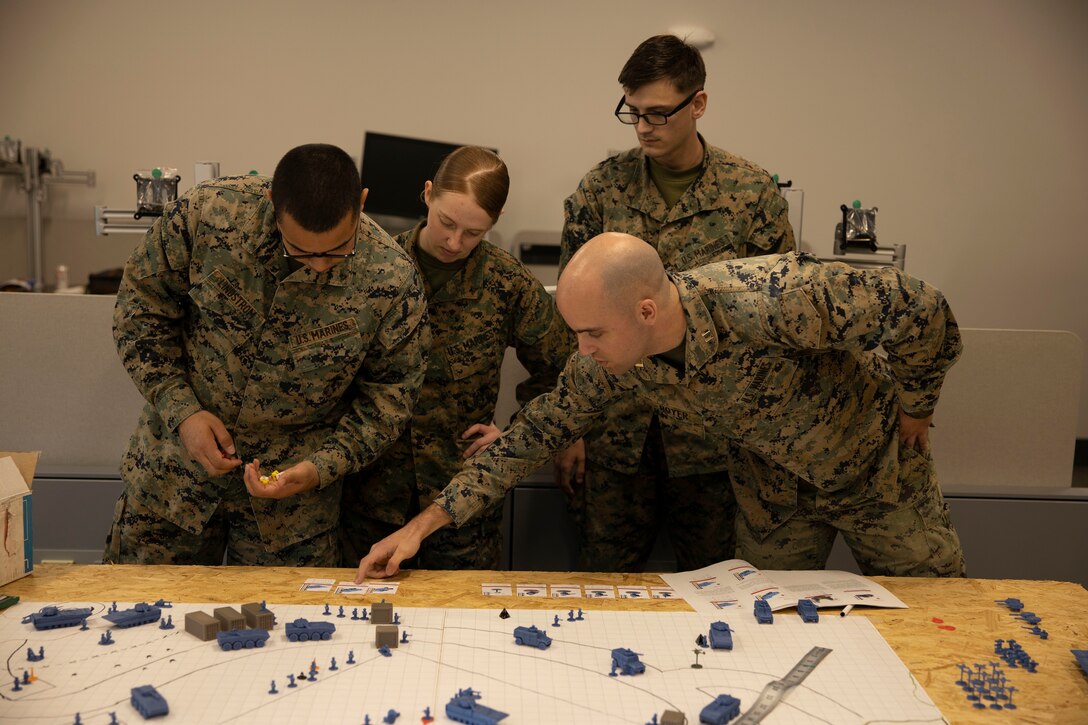 U.S. Marines with II Marine Expeditionary Force (II MEF) participate in the wargame “Down Range” at Marine Corps Base Camp Lejeune, North Carolina, March 6, 2025. Down Range is a flexible, quick-to-learn wargame that lets players explore scenarios with over 100 individual units in a fast-paced environment, created by Capt. Nicholas Royer, a modeling and simulation officer with II MEF. (U.S. Marine Corps photo by Cpl. Marc Imprevert)