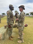 U.S. Army Soldier participating in the "Earning my Suprs" tradition for the 19D Calvary Scouts