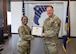 U.S. Air Force Brig. Gen. Gwendolyn Foster, and Col. Matthew Darling pose for a photo after Darling received his Continuous Improvement Green Belt certification at Wilford Hall Ambulatory Surgical Center, Joint Base San Antonio-Lackland, Texas, March 7, 2025.