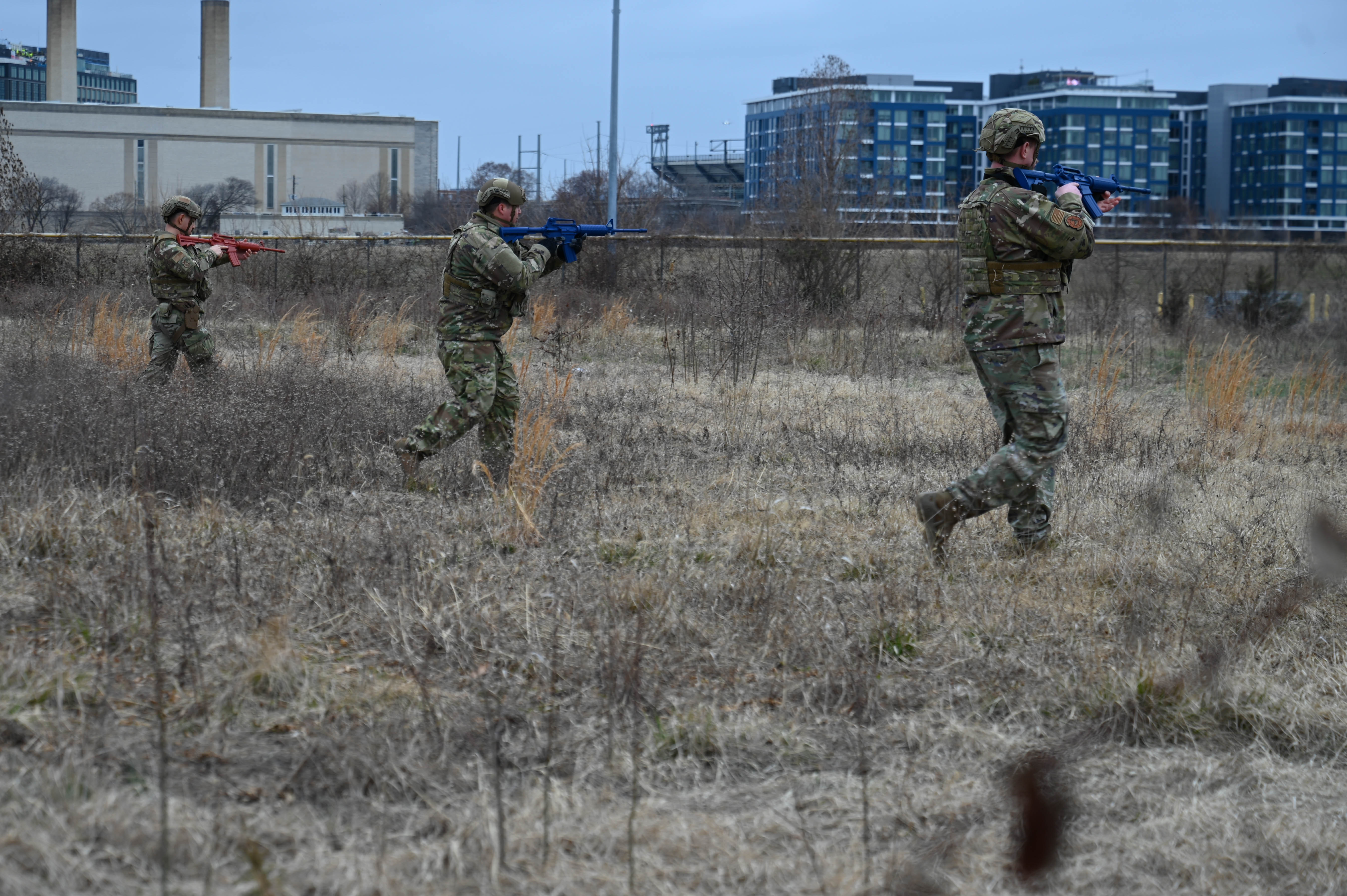 Airmen assigned to the 11th Security Forces Squadron push forward during a proficiency evaluation on individual, fire team and squad movement techniques at Joint Base Anacostia-Bolling, Washington, D.C., March 5, 2025. Security forces members received feedback on their reactions to enemy contact and indirect fire scenarios which helped improve and prepare them for Mission Focused Rehearsal Training at Fort Bliss, Texas. (U.S. Air Force photo by Airman 1st Class Geneva Nguyen)