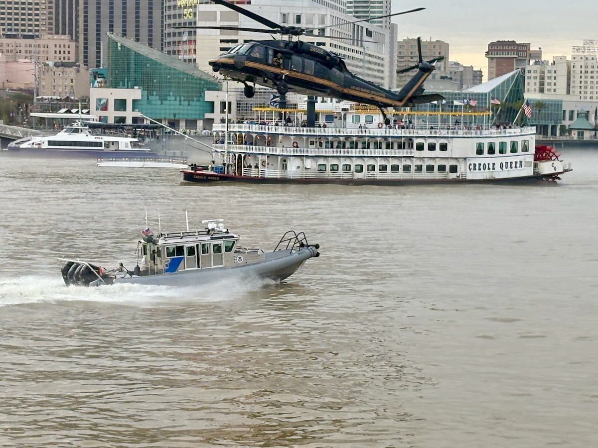 Helicopter flies low over Mississippi River in New Orleans