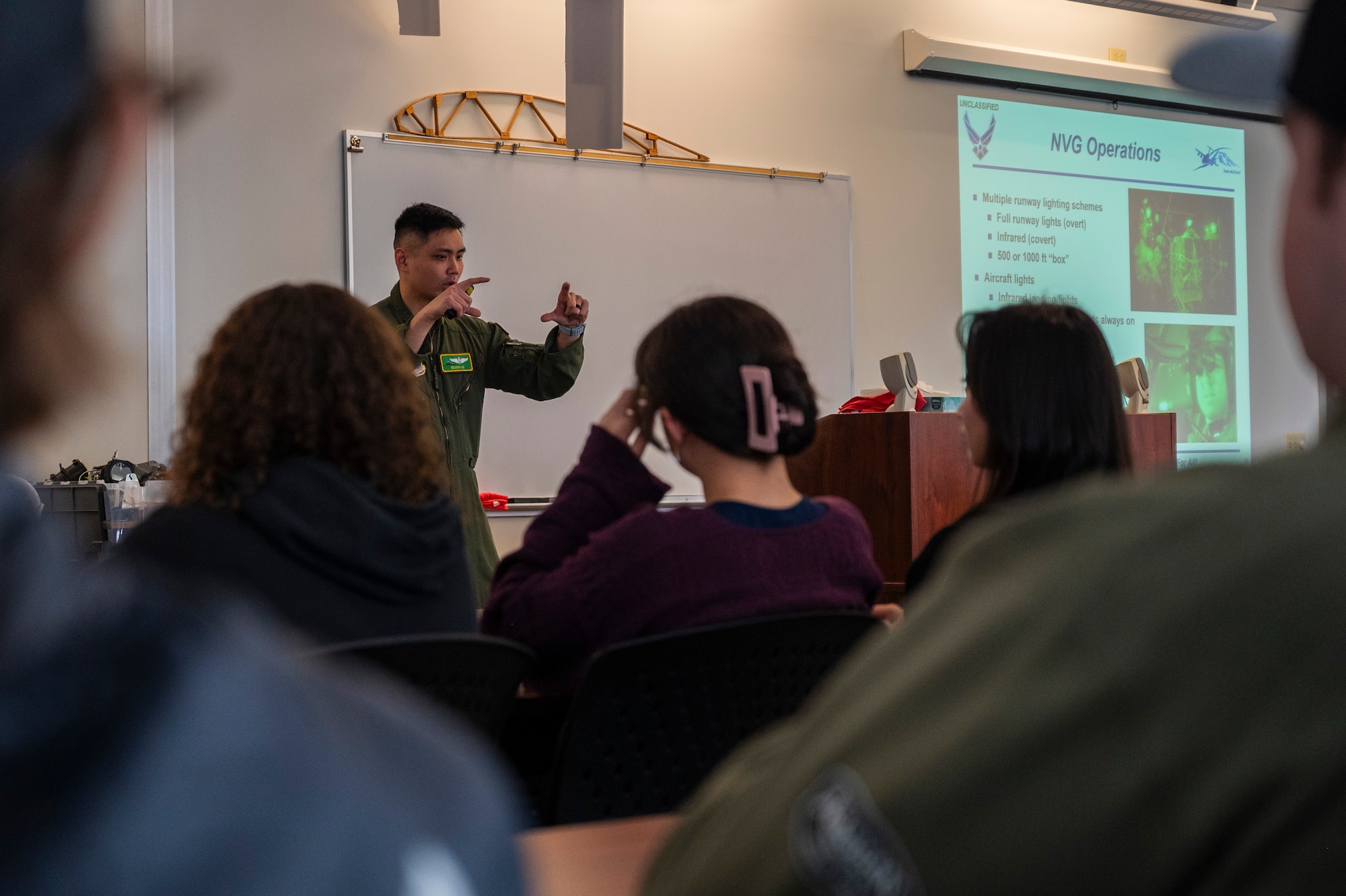 U.S. Air Force Maj. Nelson Liu, 62d Airlift Wing chief of flight safety, describes night flying safety procedures during a midair collision avoidance brief given to Big Bend Community College aviation program students in Moses Lake, Washington, March 7, 2025.