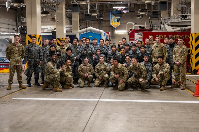 U.S. Air Force members assigned to the 35th Fighter Wing and Japan Air Self Defense Force members pose for a group photo during a bilateral HAZMAT exercise at Misawa Air Base, Japan, March 7, 2025. The joint training allowed participants to refine response tactics through hands-on practice, improve their understanding of hazardous material threats, and develop the skills necessary to protect personnel, infrastructure and mission-critical assets in emergency situations. (U.S. Air Force photo by Senior Airman William Rodriguez)