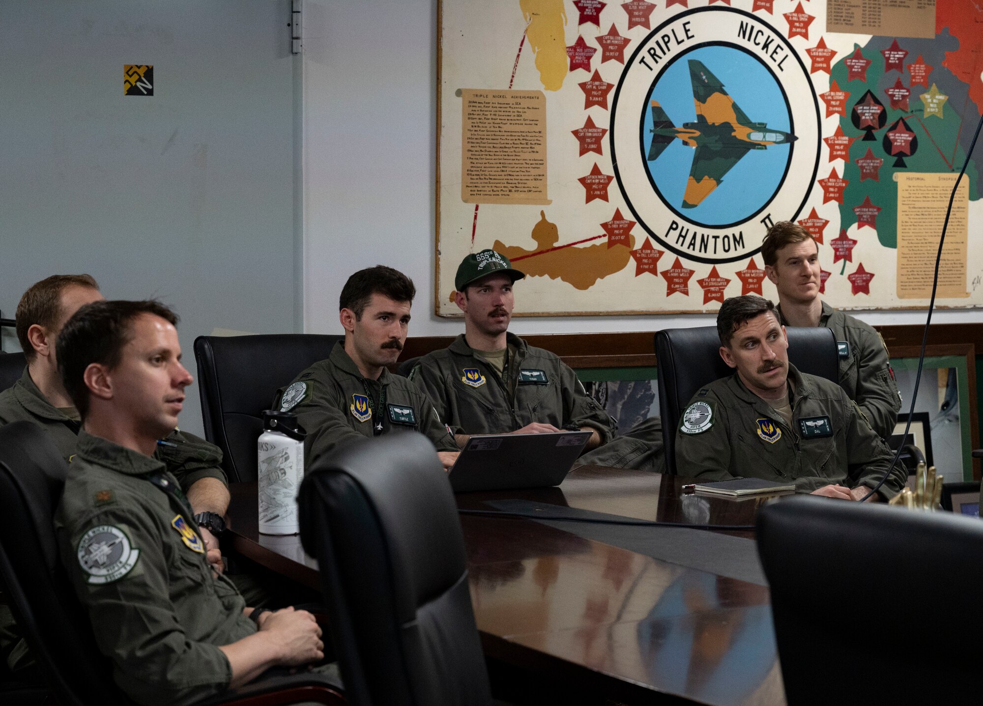 A group of people sit at a table
