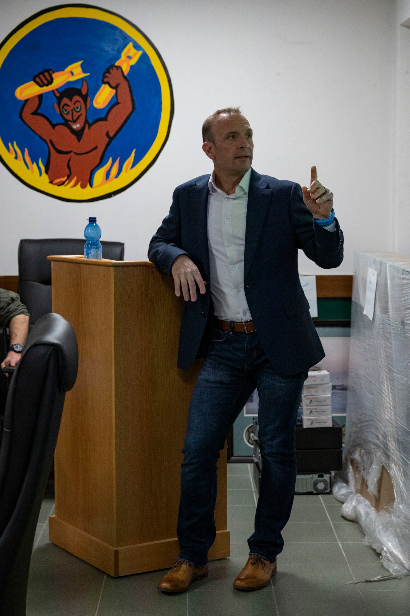 A man speaks at a podium