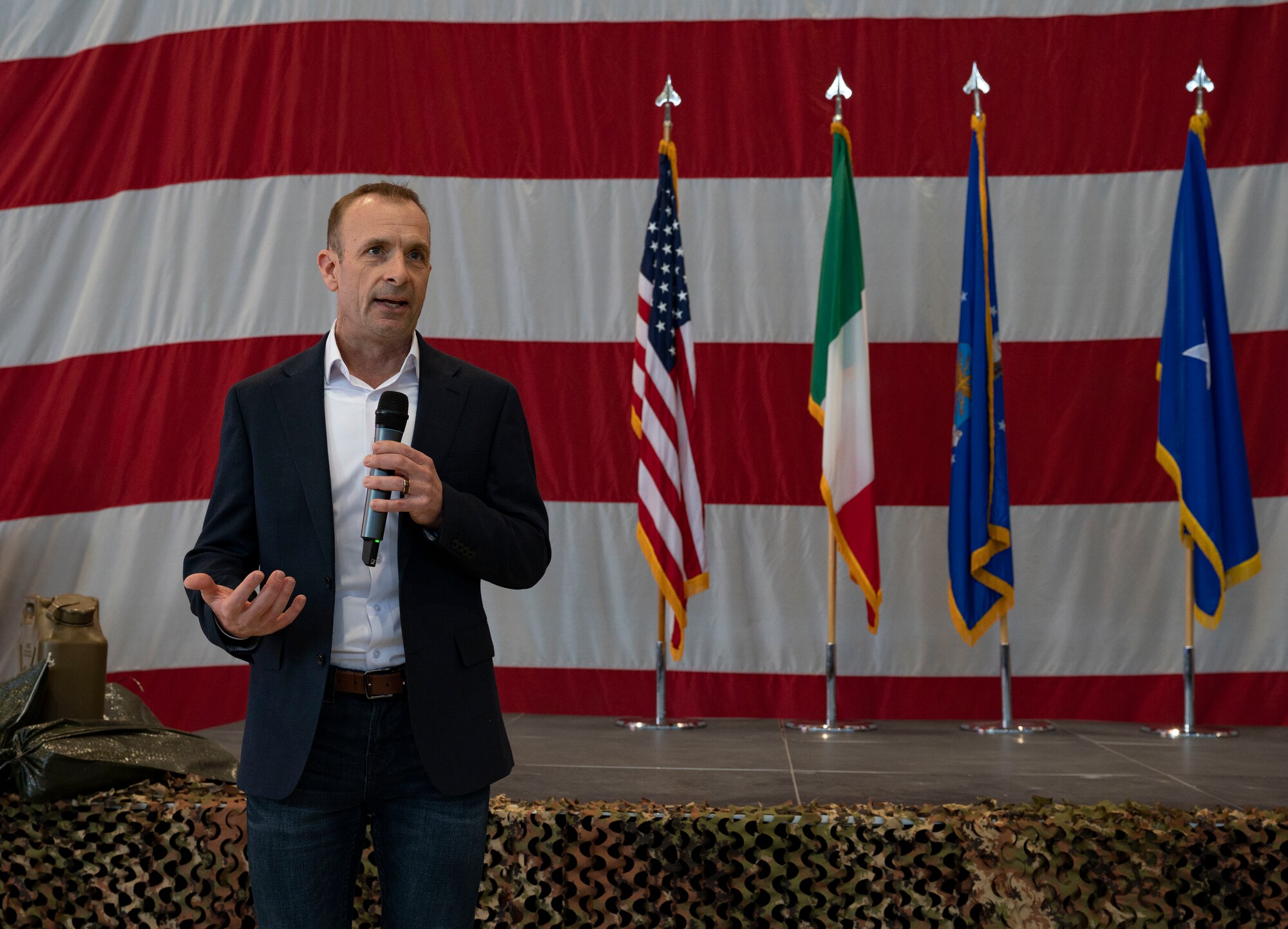 A man speaks into a microphone