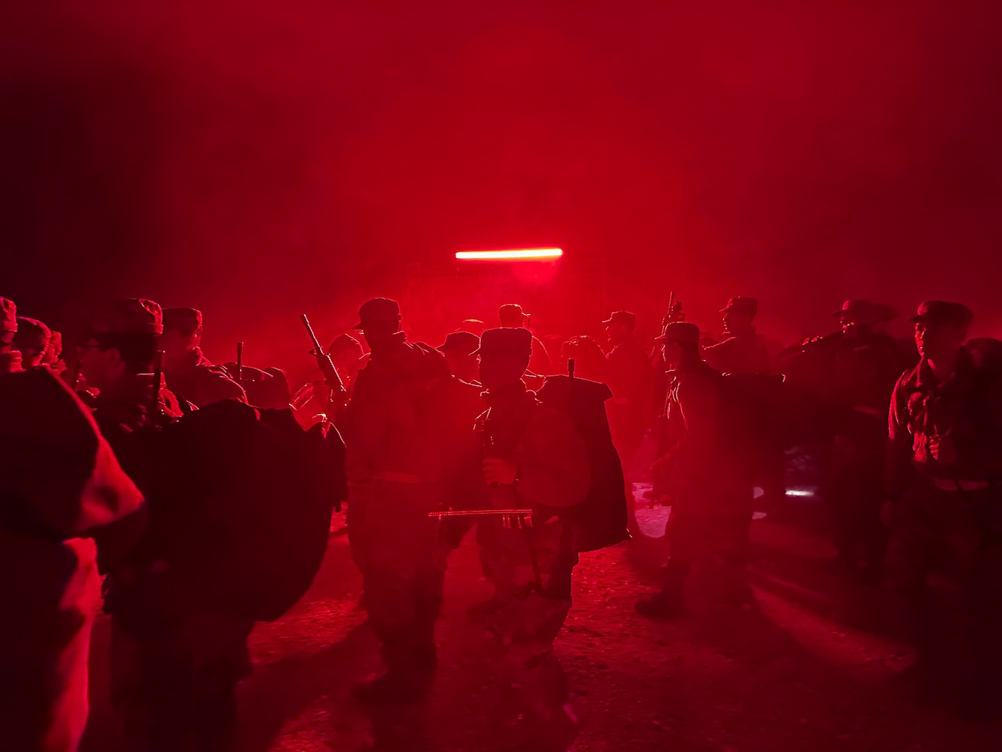 Trainees line up under the red light at the start of PACER FORGE