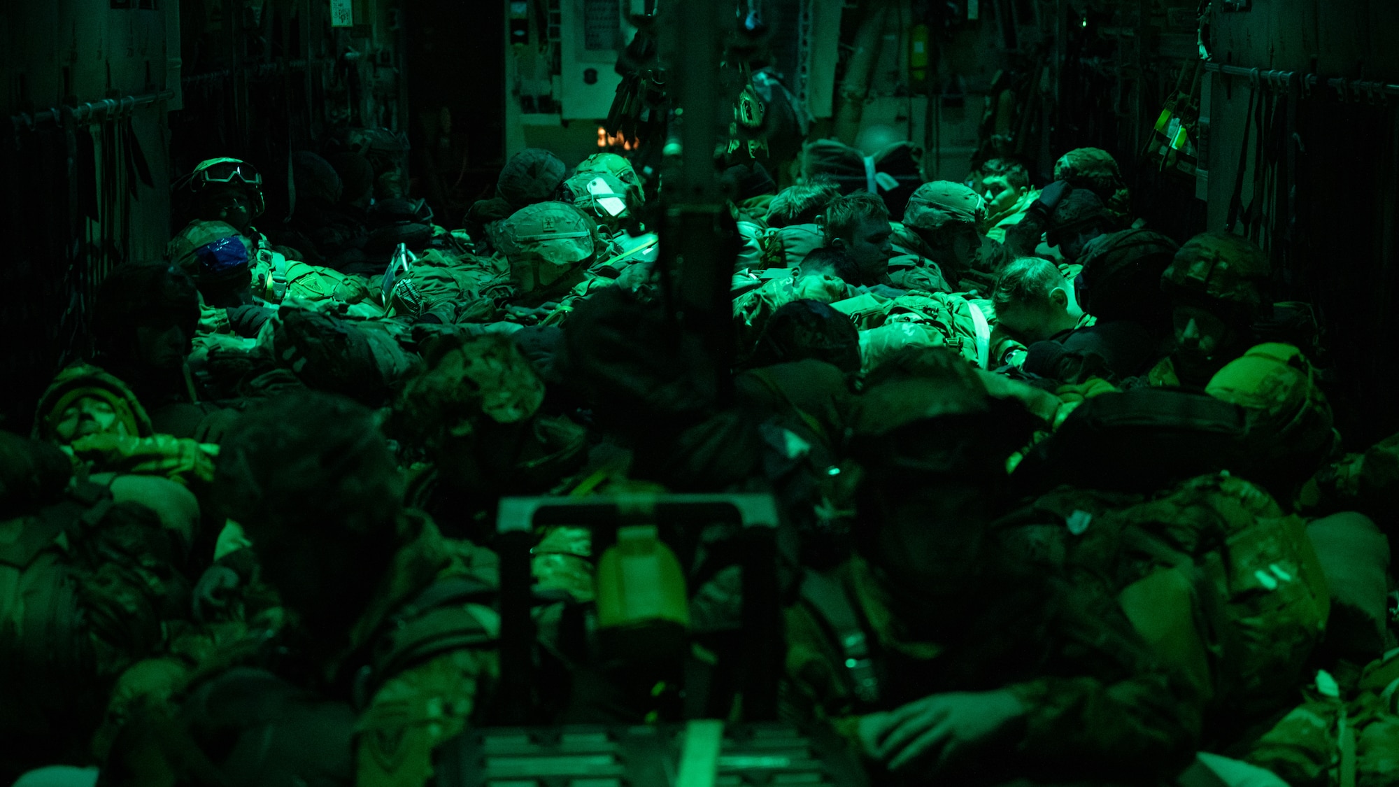 U.S. Army paratroopers from the 11th Airborne Division wait in a C-130J Super Hercules for airdrop during the Joint Pacific Multinational Readiness Center 25-02 training exercise near Joint Base Elmendorf-Richardson, Alaska, Jan. 22, 2025. The 40th Airlift Squadron airdropped paratroopers into simulated objective areas for a ground exercise in extreme cold weather, building tactical skills in Arctic environments. (U.S. Air Force photo by Airman 1st Class Jade M. Caldwell)