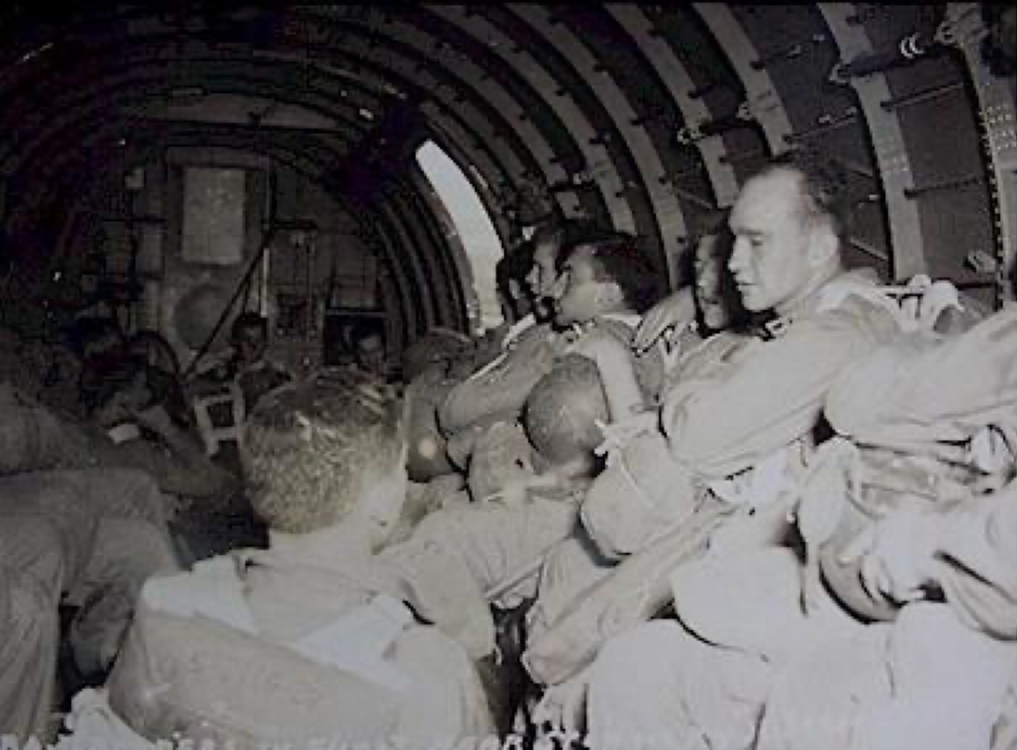 Courtesy photo by U.S. Army Signal Corps depicts 511th Parachute Infantry Regiment paratroopers enroute to Tagaytay Ridge, Feb. 3, 1945. The 317th Troop Carrier Group C-47 Skytrains airdropped the 11th Airborne Division in three groups over Tagaytay Ridge in support of the liberation of the Japanese-occupied capital, Manila. The 317th TCG and 11th AD partnered 80 years ago to support a free and open Indo-Pacific, a spirit of cooperation still represented between the two units today.  (Photo by Courtesy Photo)