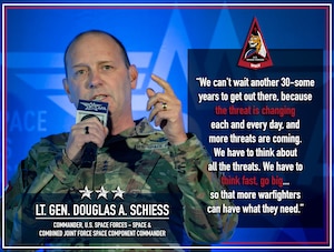 A military general speaks into a microphone.
