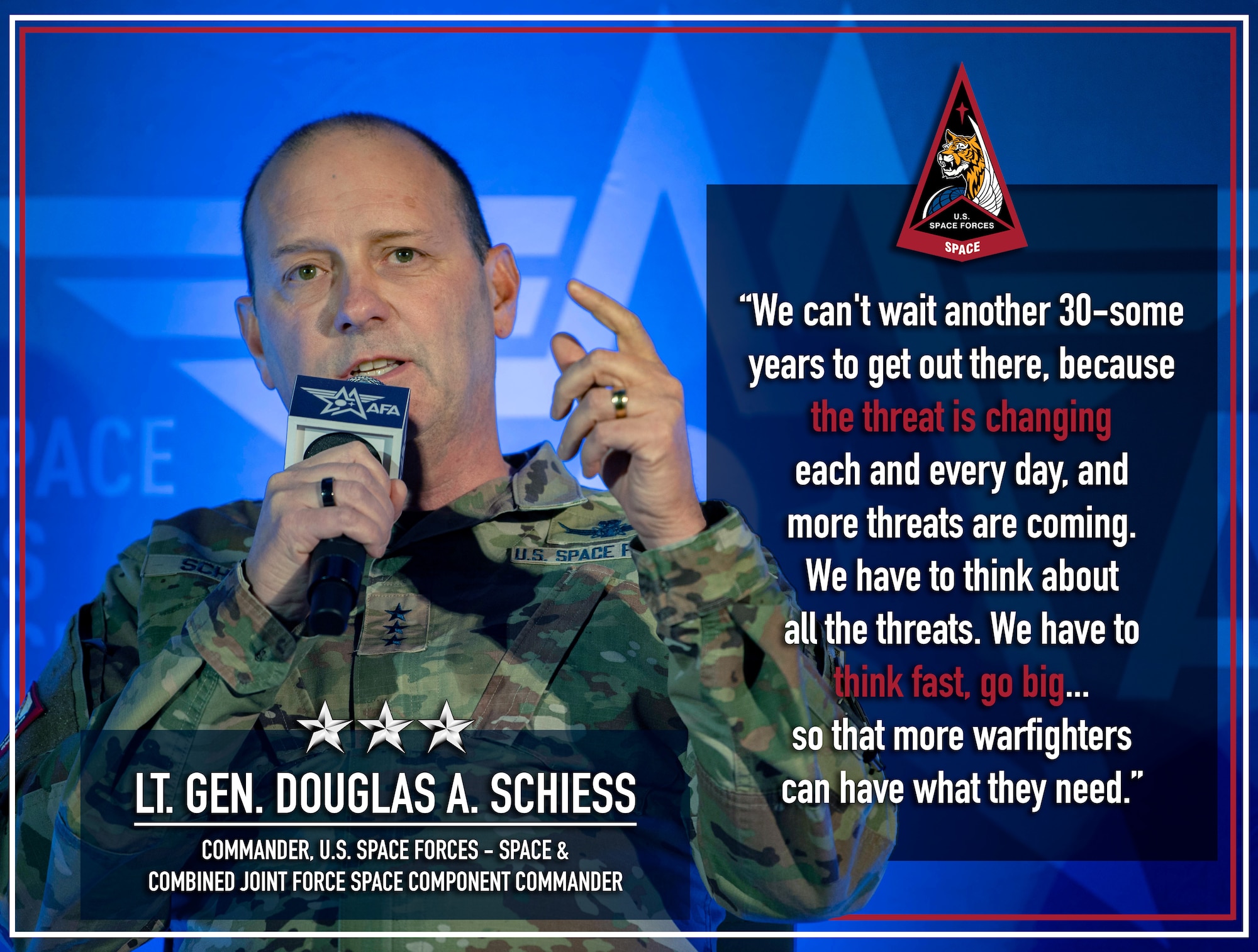 A military general speaks into a microphone.