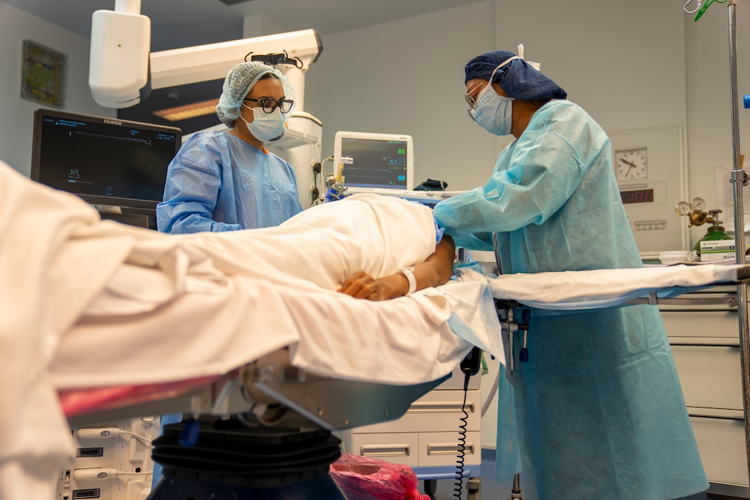 Lesser Antilles Medical Assistance Team members conduct an ultrasound-guided nerve block on a patient during the LAMAT mission at Owen King European Union Hospital in Castries, Saint Lucia, March 5, 2025. The nerve block procedure blocks pain from reaching specific nerves and can speed recovery and reduce need for post-surgery pain medication. LAMAT fosters collaboration between U.S. and host nation medical teams to facilitate knowledge sharing and skills transfer, strengthening the host nation's own healthcare capabilities. (U.S. Air Force photo by Andrea Jenkins)