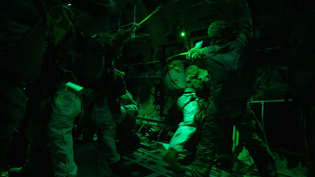 U.S. Army paratroopers from the 11th Airborne Division jump from a C-130J Super Hercules during the Joint Pacific Multinational Readiness Center 25-02 training exercise near Joint Base Elmendorf-Richardson, Alaska, Jan. 22, 2025. The 40th Airlift Squadron airdropped paratroopers into simulated objective areas for a ground exercise in the Arctic, requiring Airmen and Soldiers to quickly adapt to changing extreme cold weather conditions. The cooperation of the 40th AS and 11th AD is an 80 year legacy beginning in the Pacific Theater and reuniting again to further training in the Indo-Pacific. (U.S. Air Force photo by Airman 1st Class Jade M. Caldwell)