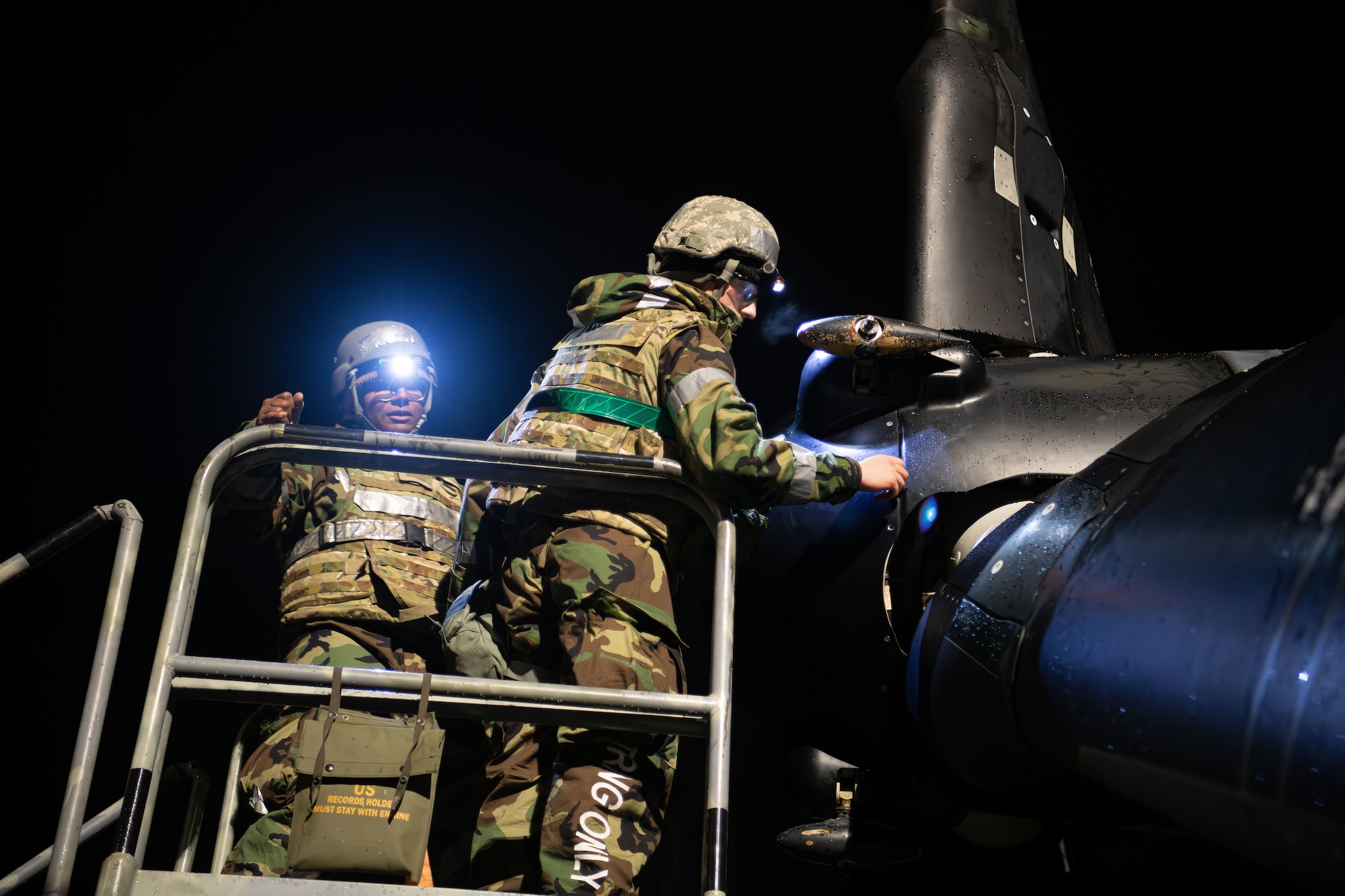 Airmen assigned to the 353rd Special Operations Wing perform maintenance on a CV-22 Osprey for exercise Beverly Morning 25-2