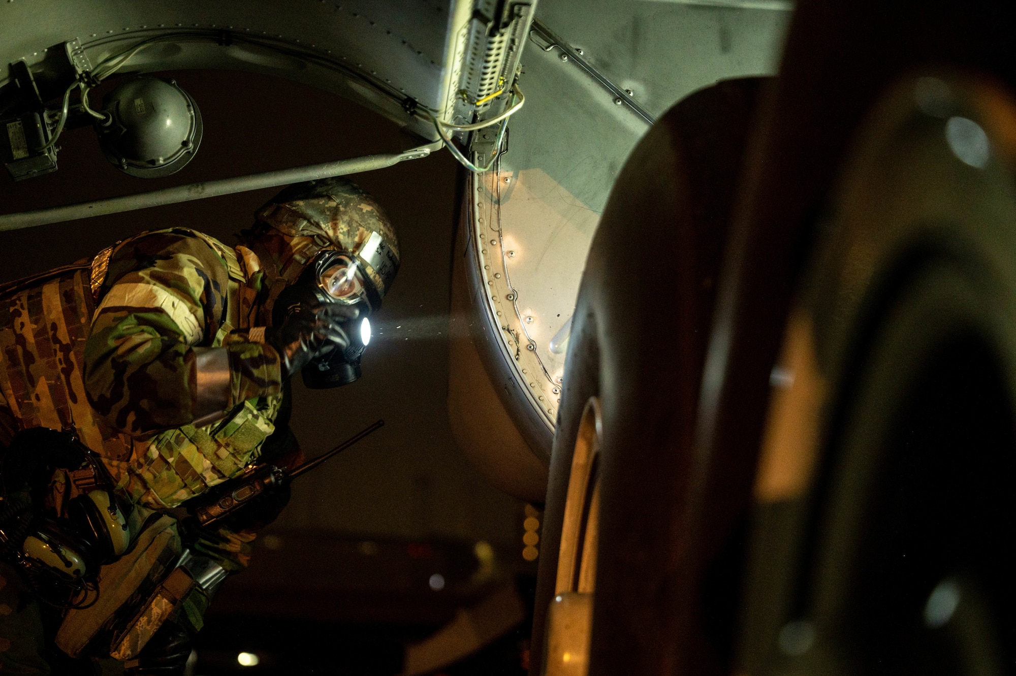 Airmen perform decontamination of the aircrew and aircraft.