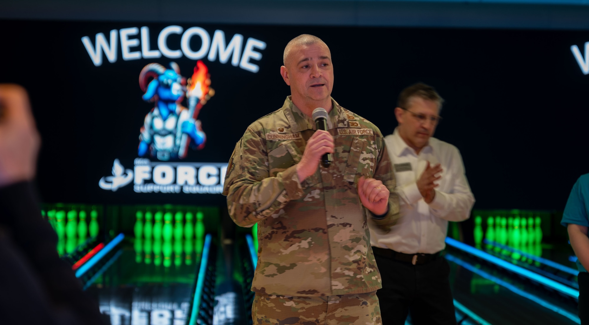 man speaks during ceremony