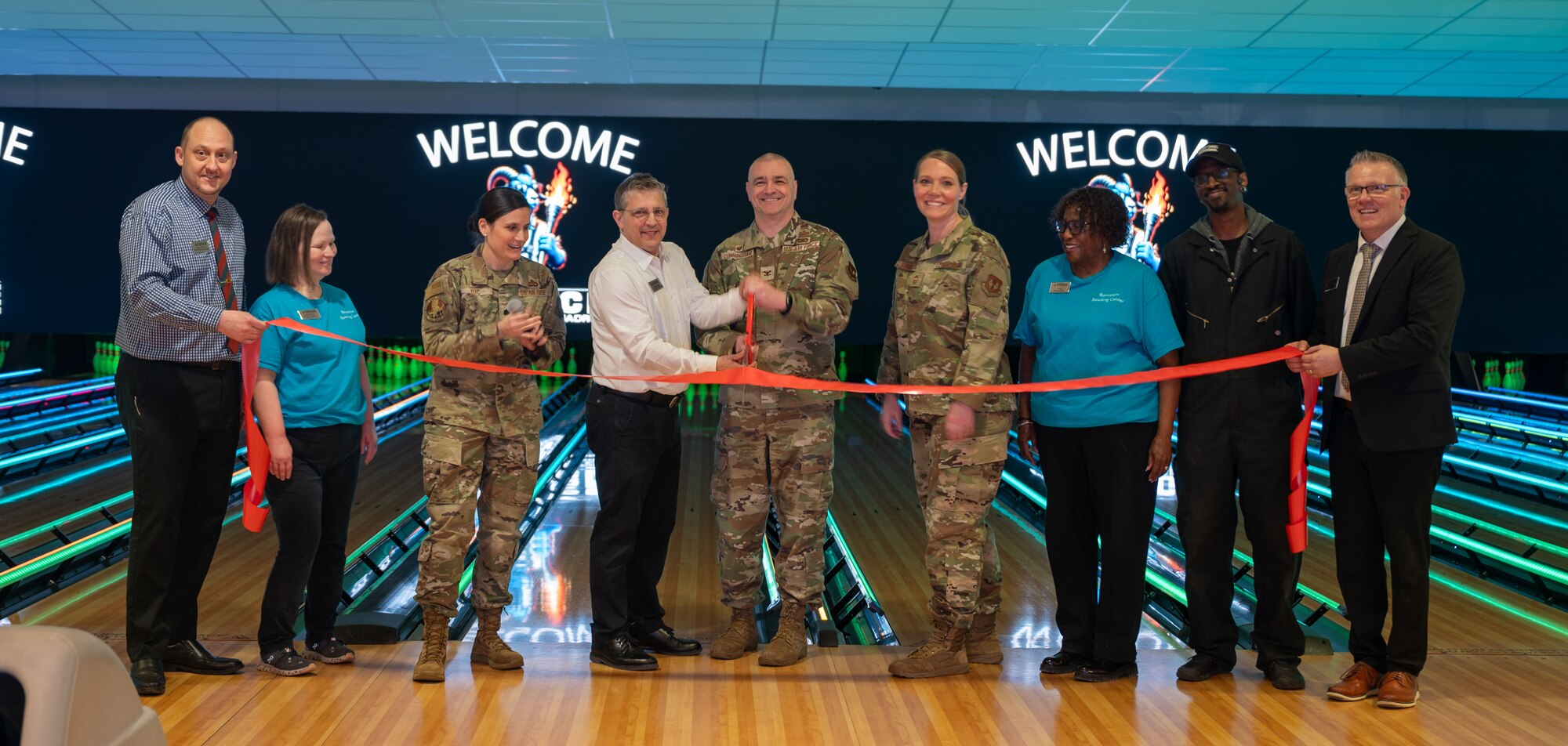 People cut ribbon at a ceremony