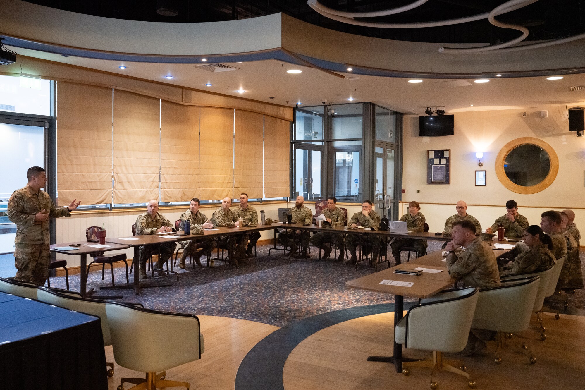 U.S. Air Force first sergeants meet with personnel from the 48th Medical Group to discuss the new shaving waiver guidance at RAF Mildenhall, England, Feb. 26, 2025.