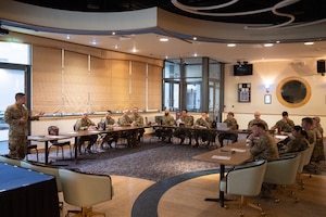 U.S. Air Force first sergeants meet with personnel from the 48th Medical Group to discuss the new shaving waiver guidance at RAF Mildenhall, England, Feb. 26, 2025.