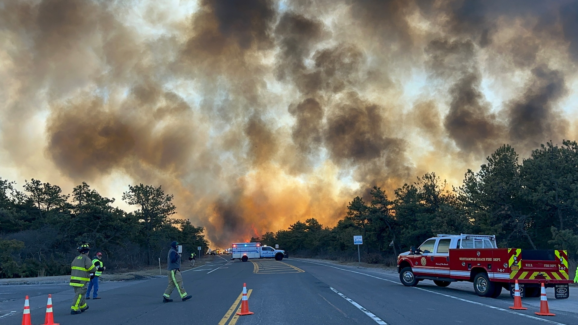 Members of the New York Air National Guard's 106th Rescue Wing Fire Department and other local fire departments respond to the Pine Barrens fire off Sunrise Highway on Long Island, N.Y., March 8, 2025.