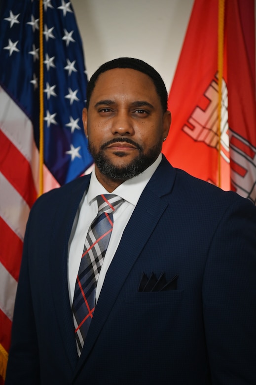 Man official photo with flags