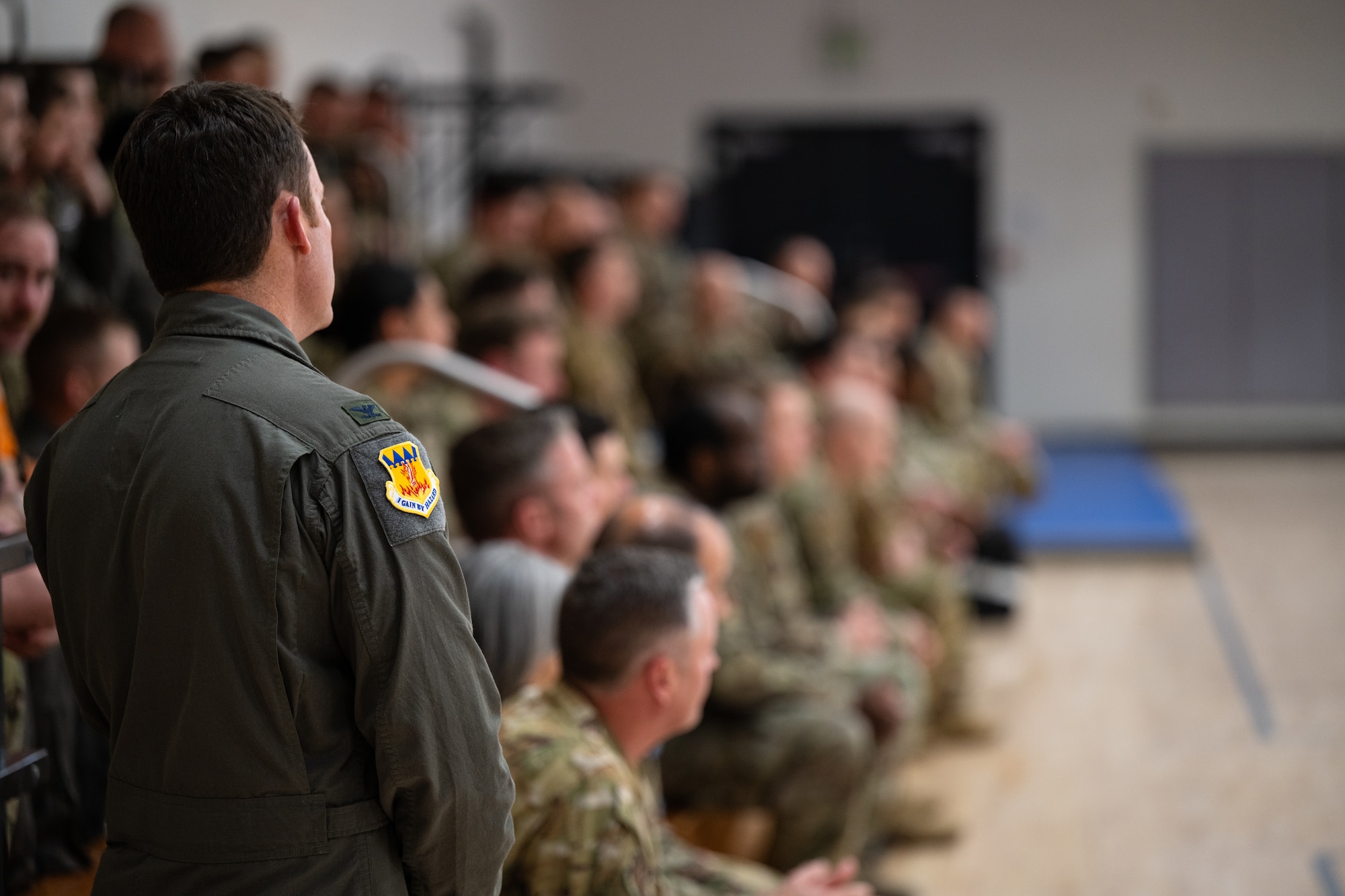 Airmen assigned to the 317th Airlift Wing listen to Dr. Jannell MacAulay, a strategic health and human performance specialist, during Warrior Heart Day at Dyess Air Force Base, Texas, March 5, 2025. MacAulay spoke on the importance of staying mission-ready through the discipline of maintaining focus with the right techniques. She demonstrated to Airmen how the Mind Gym at the base fitness center can improve the warrior mindset and provided the tools to focus on mission success. (U.S. Air Force photo by Airman 1st Class Jade M. Caldwell)