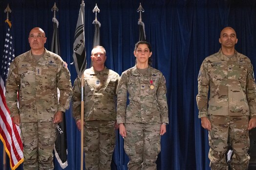  From left, U.S. Space Force Lt. Gen. David N. Miller, Jr., Space Operations Command commander; Chief Master Sgt. Kevin Pfister, Mission Delta 3 senior enlisted leader; Col. Nicole Petrucci, outgoing MD 3 commander; and Col. Angelo Fernandez, incoming MD 3 commander, stand at attention while orders are read at MD 3’s change of command ceremony at Peterson Space Force Base, Colorado, March 7, 2025. The units now falling under Fernandez’s command include the 4th, 5th, 16th, and 23rd Electromagnetic Warfare Squadrons, the 37th Tactical Intelligence Squadron, and the 3rd Combat Training Squadron. MD 3 prepares and presents combat-ready space electromagnetic warfare professionals to integrate, synchronize, and execute fires for U.S., Allied, and Coalition forces. The unit operates electromagnetic attack, protection, and support capabilities to protect and defend the space domain in support of combatant commands and the joint warfighter. (U.S. Space Force photo by Staff Sgt. Jaime Sanchez)
