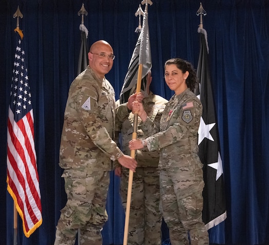  U.S. Space Force Lt. Gen. David N. Miller, Jr., Space Operations Command commander, left, receives the guidon from Col. Nicole Petrucci, outgoing Mission Delta 3 commander, during the MD 3’s change of command ceremony at Peterson Space Force Base, Colorado, March 7, 2025. MD 3 operates electromagnetic attack, protection, and support capabilities to protect and defend the space domain in support of combatant commands and the joint warfighter. During Petrucci’s command, the unit transitioned to a provisional integrated mission delta construct, now mission delta, that organizes service activities around mission areas instead of functional specialties. Petrucci will go on to the Space Operations Command Headquarters staff to lead Future Operations. (U.S. Space Force photo by Staff Sgt. Jaime Sanchez)