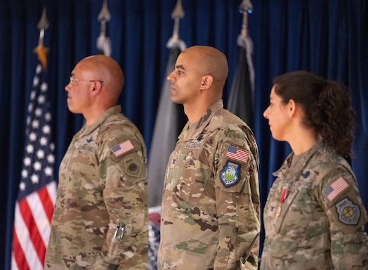  From left, U.S. Space Force Lt. Gen. David N. Miller, Jr., Space Operations Command commander; Col. Angelo Fernandez, incoming Mission Delta 3 commander; and Col. Nicole Petrucci, outgoing MD 3 commander, stand at attention during the closing of MD 3’s change of command ceremony at Peterson Space Force, Colorado, March 7, 2025. During Petrucci’s command, the unit transitioned to a provisional integrated mission delta construct, now mission delta, that organizes service activities around mission areas instead of functional specialties. Petrucci will go on to the Space Operations Command Headquarters staff to lead Future Operations. The units now falling under Fernandez’s command include the 4th, 5th, 16th, and 23rd Electromagnetic Warfare Squadrons, the 37th Tactical Intelligence Squadron, and the 3rd Combat Training Squadron. (U.S. Space Force photo by Staff Sgt. Jaime Sanchez)