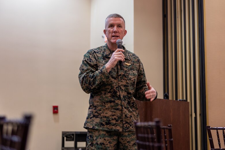 MajGen Woodworth speaking into a microphone.