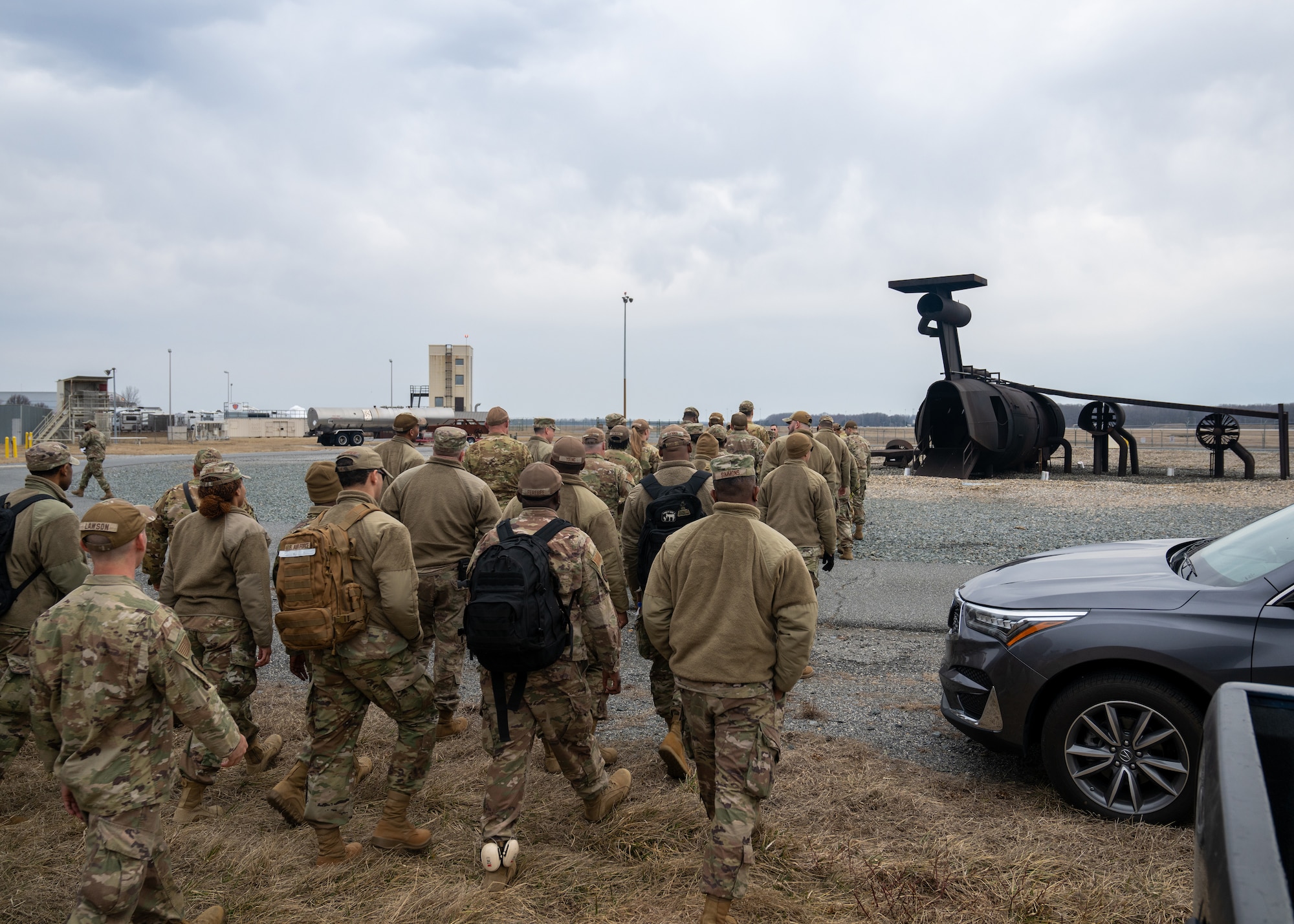Airmen walk to receive equipment