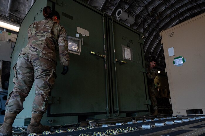 Airmen offload cargo from a C-17 Globemaster III