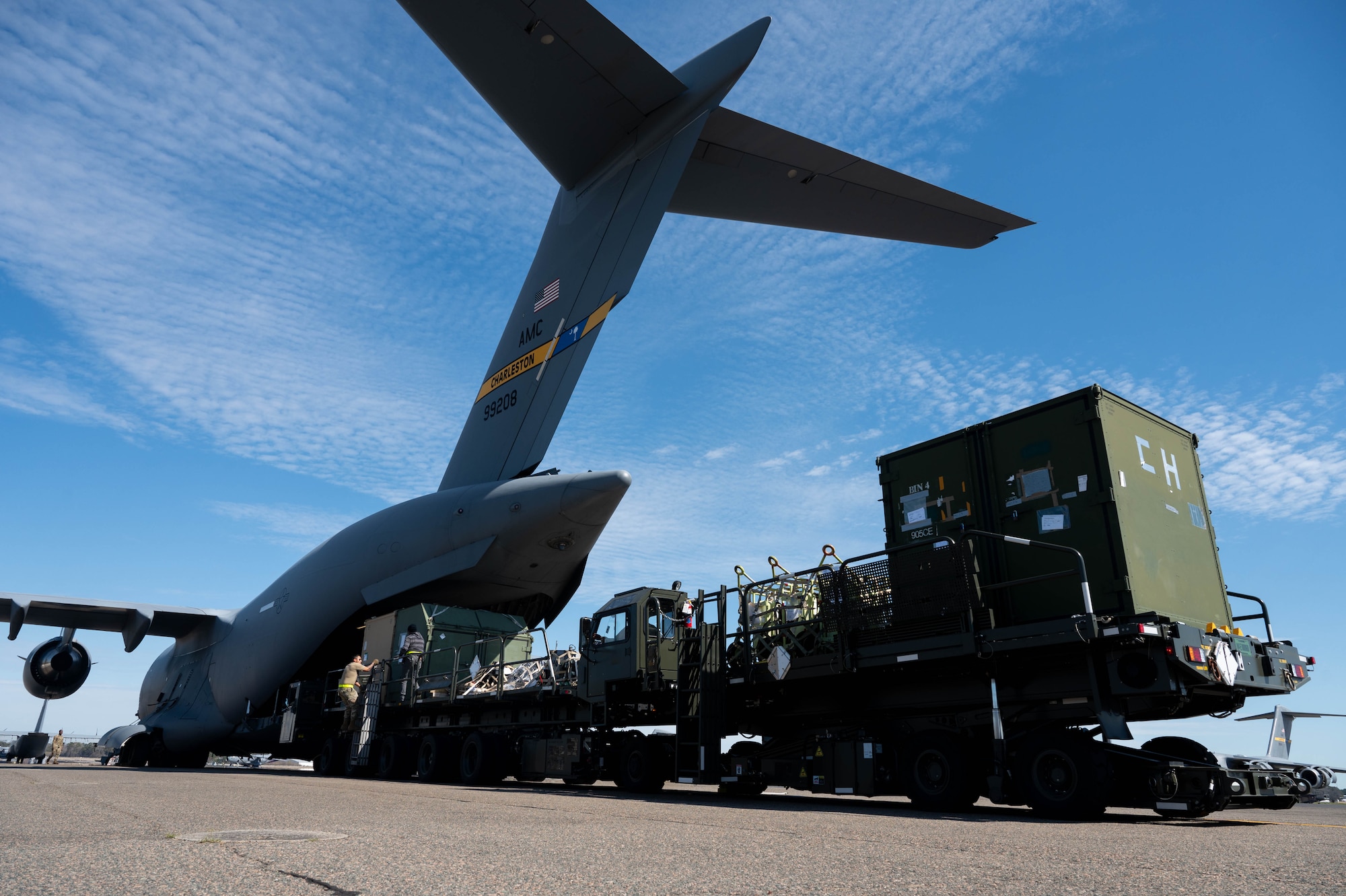 Airmen off load cargo from a C-17 Globemaster III