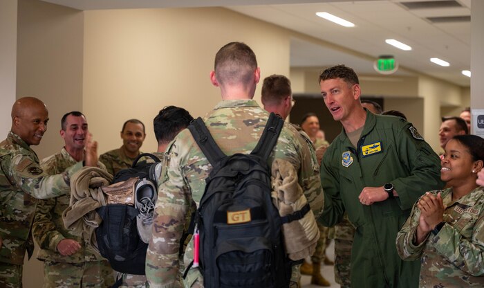 Airmen are greeted by 437th Airlift Wing leadership